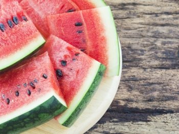 Watermelon on old wooden background