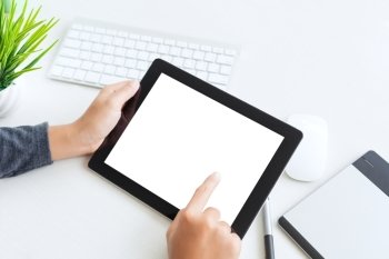 hand using digital tablet finger touch blank screen on desk work table