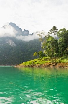 Beautiful green river and mountains in Ratchaprapha Dam, Khao Sok National Park, Surat Thani Province, Thailand
