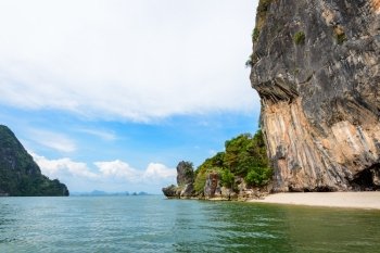 Beautiful landscape of sea sky and beach landing for boats travel to Khao Tapu or James Bond Island in Ao Phang Nga Bay National Park, Thailand