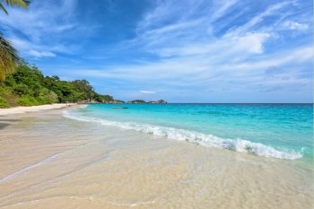 Beautiful landscape of blue sky sea sand and white waves on the beach during summer at Koh Miang island in Mu Ko Similan National Park, Phang Nga province, Thailand