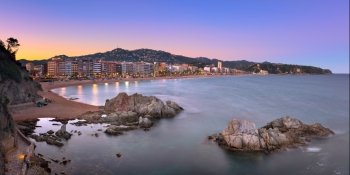 LLORET DE MAR, SPAIN - JUNE 23, 2016: Panorama of Lloret de Mar Seafront in Catalonia, Spain. Lloret de Mar is most popular Costa Brava resort and located only 75 km from Barcelona.