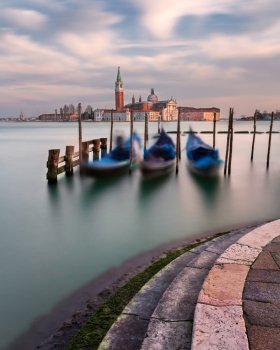Lagoon, Gondolas and San Giorgio Maggiore Church in Venice, Italy