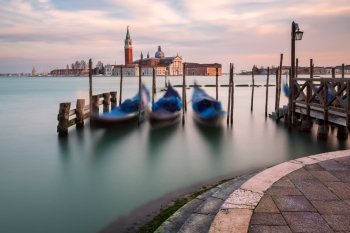 Lagoon, Gondolas and San Giorgio Maggiore Church in Venice, Italy