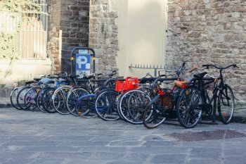 Bicycle parking on the background of the cityscape of Florence, Italy
