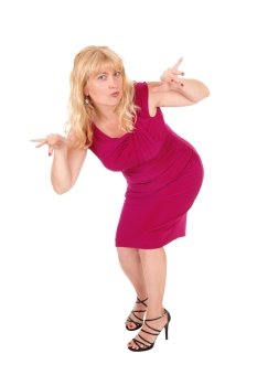 A lovely woman in a red dress standing isolated for white background gesturing with her hands.