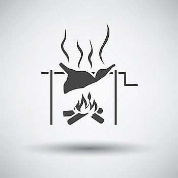 Roasting meat on fire icon on gray background with round shadow. Vector illustration.