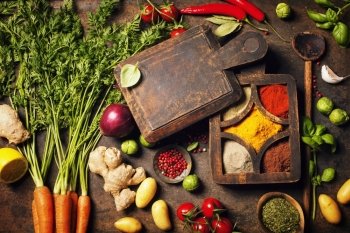 Fresh delicious ingredients for healthy cooking on rustic background.  Diet, cooking, clean eating or vegetarian food concept.