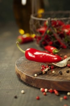 Red hot chili peppers on a wooden background
