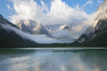 Mountain lake at misty morning. Lago di Landro, Dolomites Alps, Italy