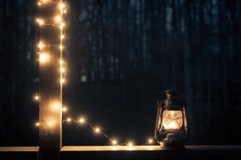 Old style lantern with lights over dark background