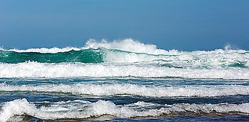Sea storm and waves with foam and splashes. Seascape view from beach.
