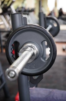 Barbell ready to workout, indooors, shallow DOF