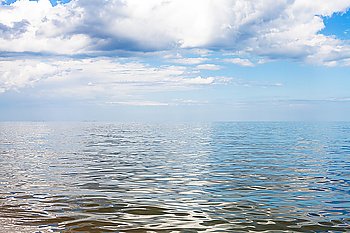 gray and white clouds over calm water of Azov Sea, Temryuk bay, Golubitskaya resort, Taman peninsula, Kuban, Russia