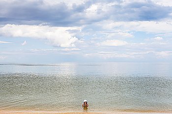 girl in water of Sea of Azov, Temryuk bay, Golubitskaya resort, Taman peninsula, Kuban, Russia