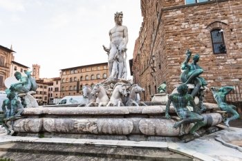 travel to Italy - Fountain of Neptune near Palazzo Vecchio on Piazza della Signoria in Florence in morning.