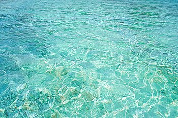 Crystal clear blue water in tropical lagoon for texture or background. Crystal clear blue water in tropical lagoon