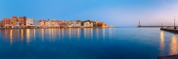 Picturesque panoramic view of old harbour with Lighthouse of Chania at sunrise, Crete, Greece
