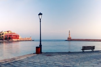 Picturesque view of old harbour with Lighthouse of Chania during morning blue hour, Crete, Greece