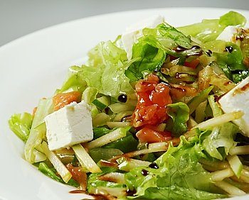Italian salad with vegetables, mozzarella cheese and apple
