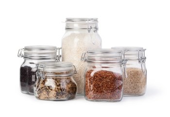 Raw rice in a jar. Raw rice in a jar isolated on white.