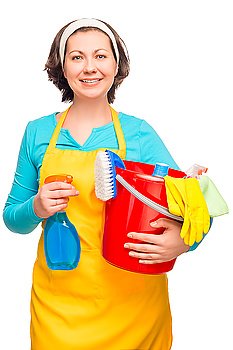 housewife posing with cleaning materials and a bucket on a white background