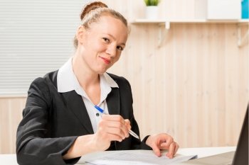 leader woman posing signature on important documents