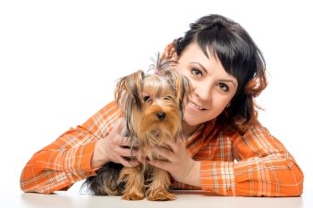 Happy woman posing with her Yorkshire terrier on a white background