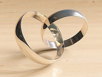 Two wedding rings  on wooden background