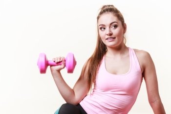 Sporty girl lifting weights. . Sporty girl lifting weights. Female gymnastic exercising with dumbbell. Health fitness workout concept. 