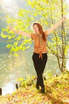 Young girl in forest. Young girl in forest. Woman posing in front of park river. Nature relax fashion beauty concept. 