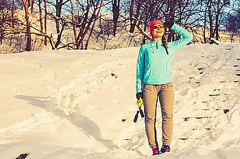Sporty girl in winter park. Sporty girl in winter park. Staying healthy during whole year. Fitness health nature concept. 
