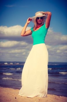 Pretty woman wearing nice clothing.. Clothes people summer concept. Pretty woman wearing nice clothing. Lady has turquoise top and white dress.