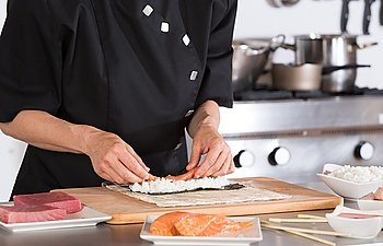 Chef preparing delicious sushi in a restaurant
