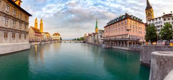 Zurich. Panoramic view of the city promenade and the facades of medieval houses at dawn. Switzerland.. Zurich. Scenic panoramic view of the city promenade and at dawn.