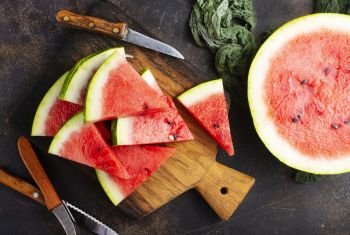 watermelon on wooden board on a table