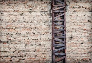 Rusty and old metal beams support system for brick wall - texture background
