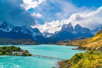 Beautiful natural view of Lake Pehoe and Cuerno del Paine Mountains with rain clouds in the sky at Torres del Paine National Park in, Chile.