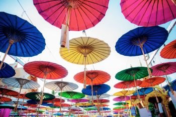 Umbrella of colorful with the sky at sunlight.