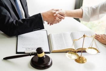 Handshake after cooperation between attorneys lawyer and clients discussing a contract agreement hope of victory over legal fighters, Concepts of law, advice