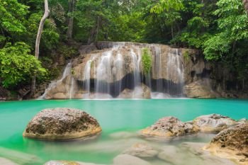 Erawan Waterfall. Nature landscape of Kanchanaburi district in natural area. it is located in Thailand for travel trip on holiday and vacation background, tourist attraction.
