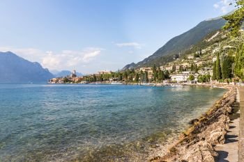 Coastline of lago di garda: Blue water and little village Malcesine