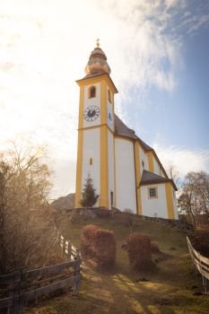 Beautiful little church on a hill, blue sky