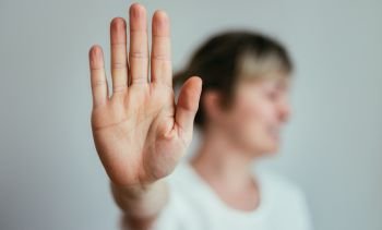 Girl showing stop gesture, close up of the hand