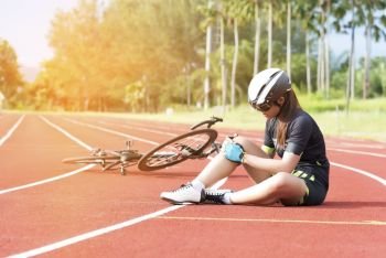 Girl has sport accident injury at her knee from bicycle, Sport and Accident concept