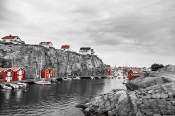 small red huts at the ocean in scandinavia