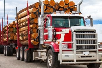 Heavy loaded timber transport truck in British Columbia Canada. Heavy loaded timber transport truck in British Columbia 