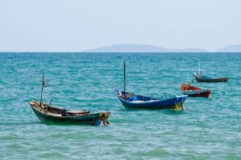 4 fisherman boats in sea with copy space