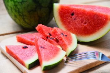 Watermelon slice on wooden cutting board summer fruit 