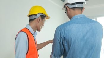 Architects and engineers examine the interior of the home to create a successful building plan before delivering quality housing to the customer.